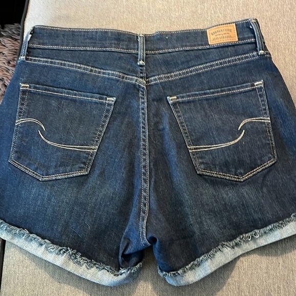 Levi’s high rise shorts size 10 waist is 30. Has a slight cuff with fraying. - Picture 3 of 5